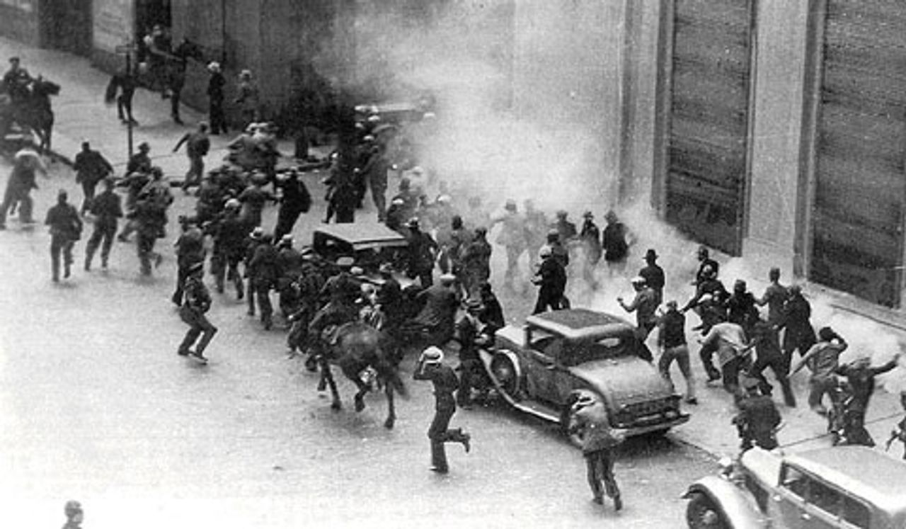 July 1934: Police use tear gas as strikers battle police on the Embarcadero.  (Photo: San Francisco History Center, San Francisco Public Library)