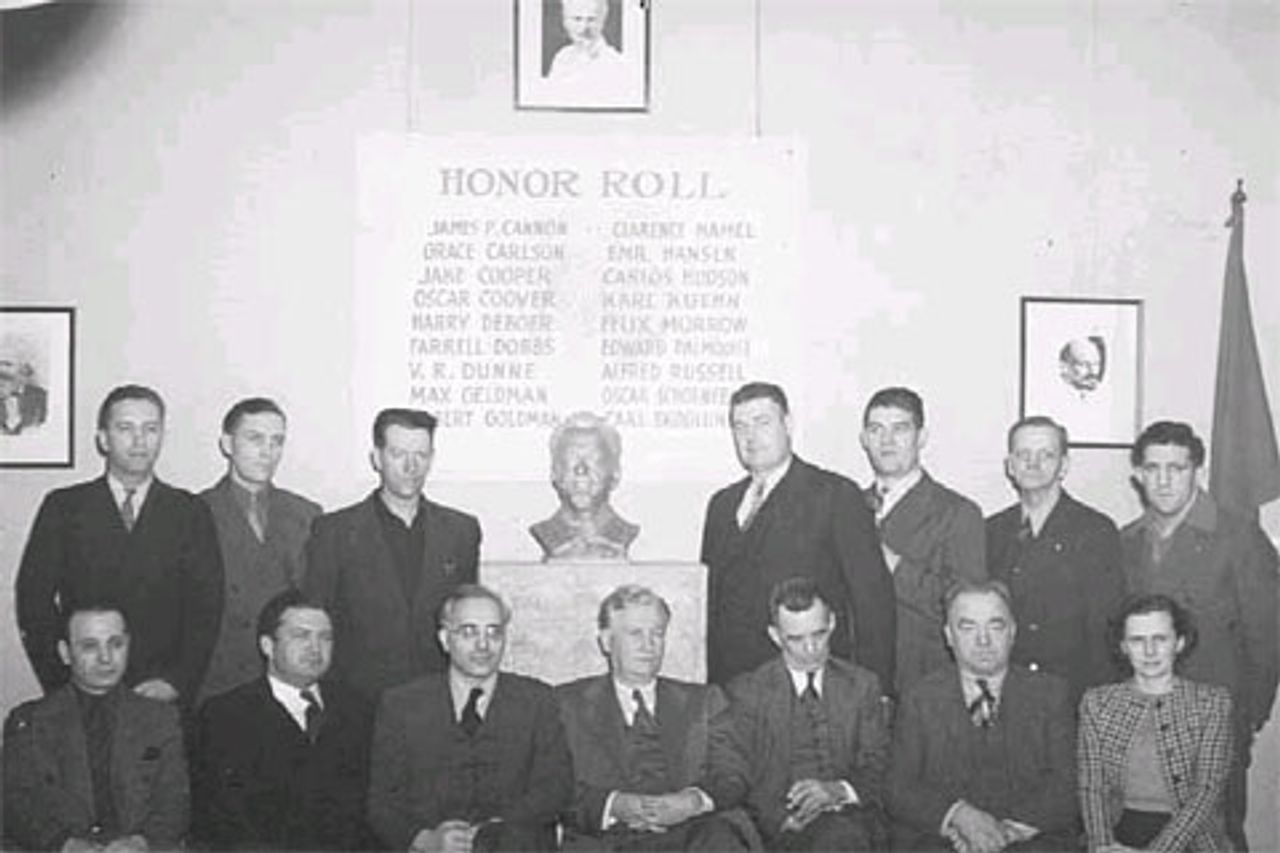1941: Fourteen of the eighteen SWP members convicted under the Smith Act. Back row, left-to-right: Farrell Dobbs, Harry DeBoer, Edward Palmquist, Clarence Hamel, Emil Hansen, Oscar Coover, Jake Cooper; Front row, left-to-right: Max Geldman, Felix Marrow, Albert Goldman, James Cannon, Vincent Dunne, Carl Skoglund, Grace Carlson.