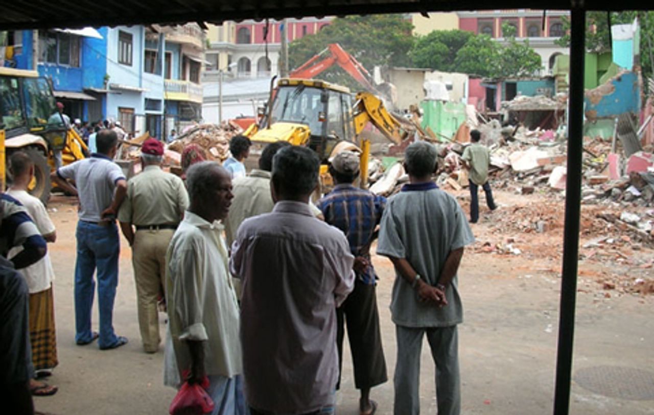 Bulldozer destroying homes