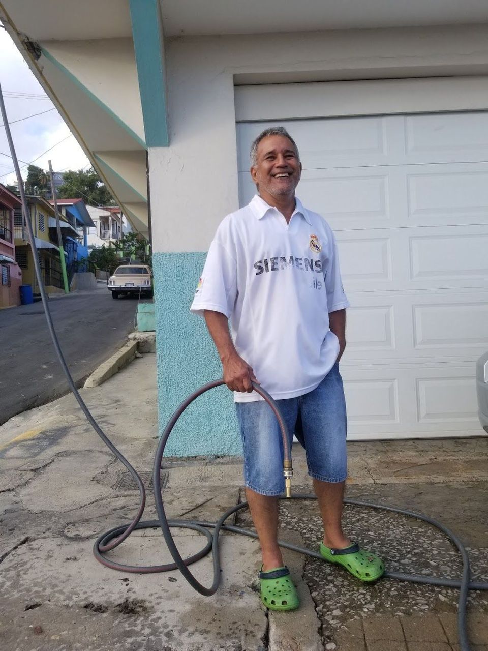 Saul Muñez outisde his home in Yauco, Puerto Rico