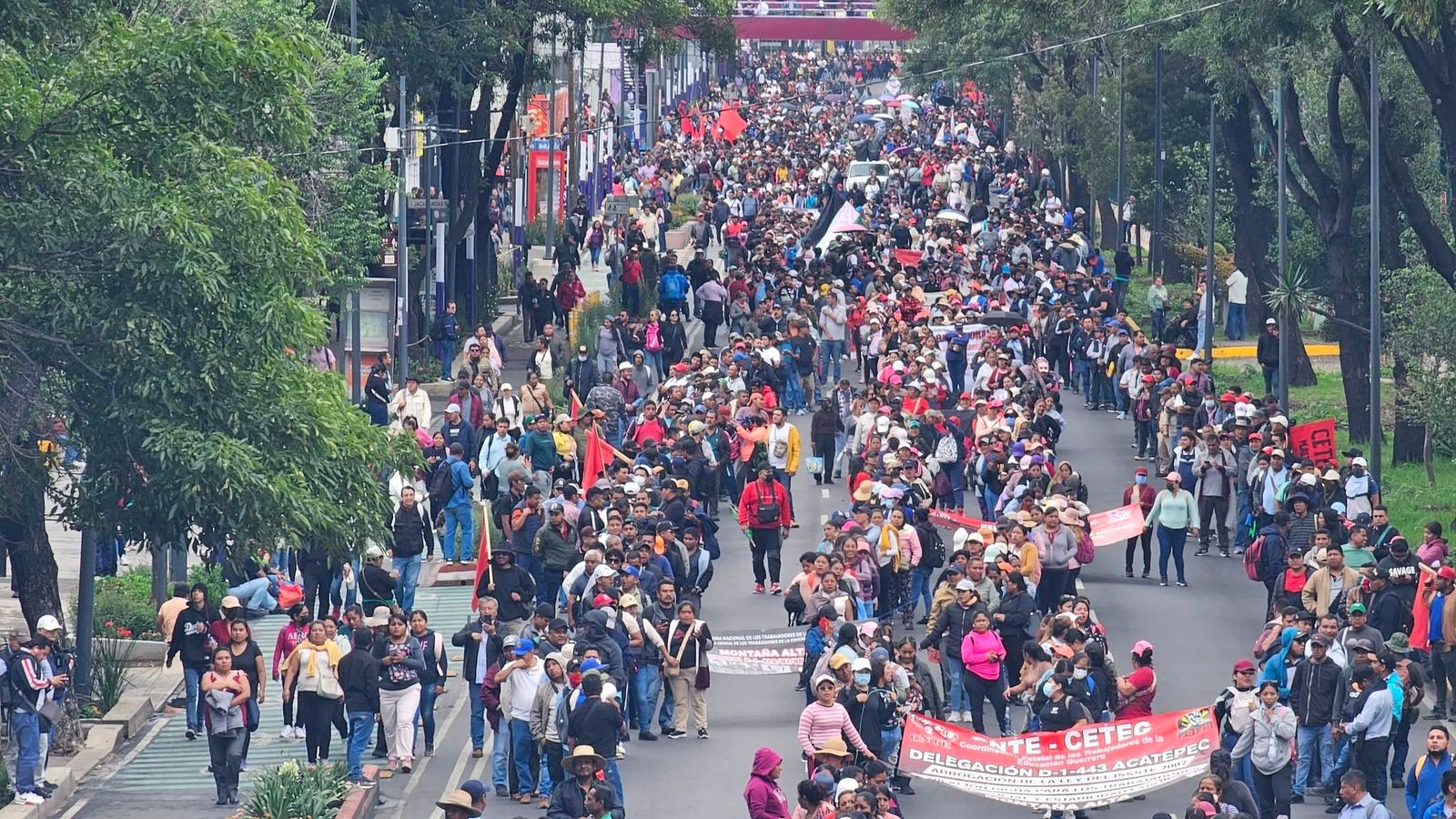 Mexico’s teachers march against wage and pension cuts as tens of millions are doled out on FIFA World Cup