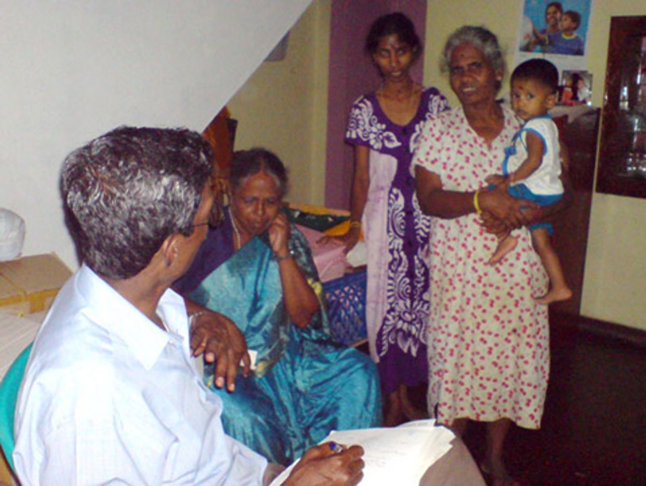 SEP campaigner speaking with Tamil family