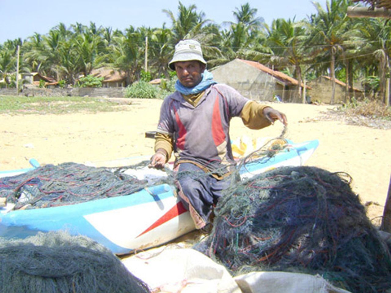A fisherman preparing his nets