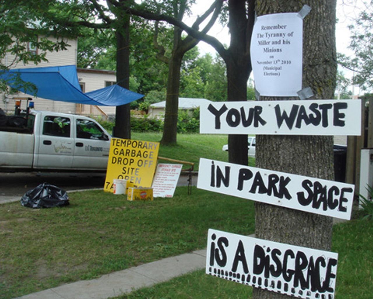 Signs posted by nearby residents at the Christie Pitts Park