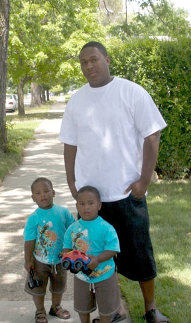Andrew Hairston and his two sons. He is visiting his mother, who lives across the street from the Reed-Owens family.