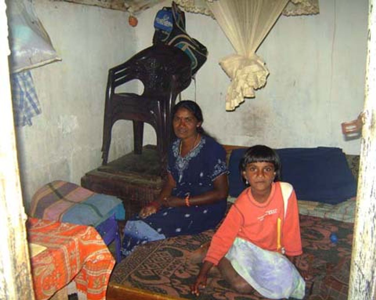 Estate worker and her daughter inside their rented room