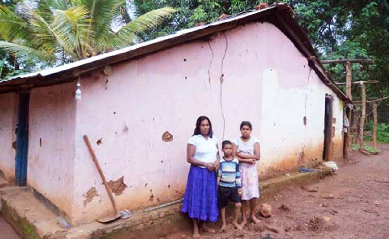 Farming family outside their Welwala home