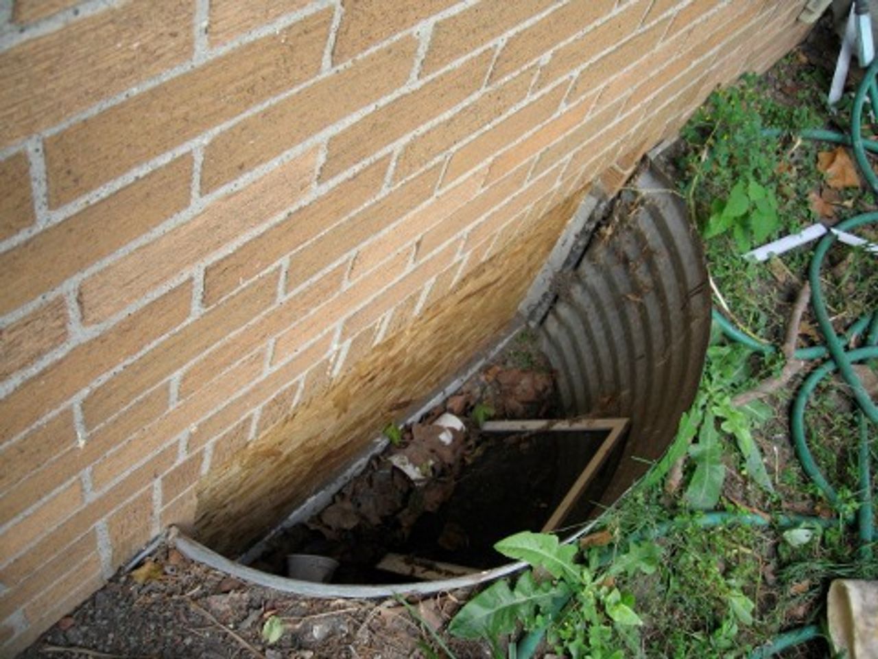 Basement window where children climbed out of the house