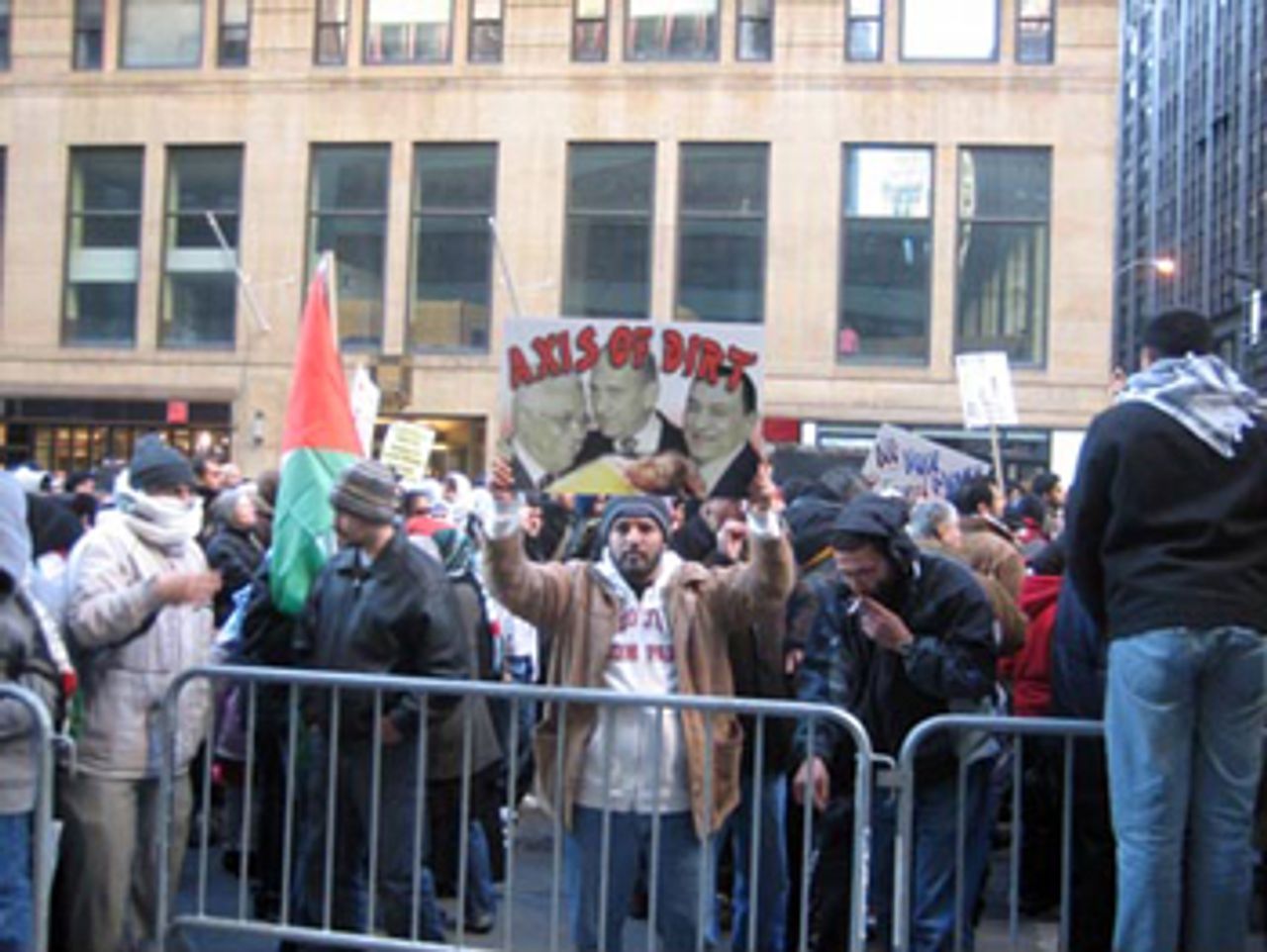 Sign at Times Square rally protests Arab regimes' complicity in Israeli attacks on Gaza.