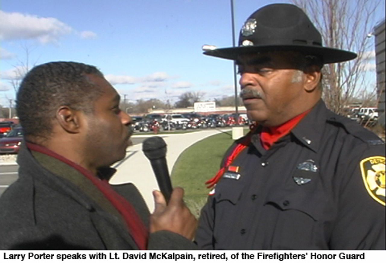 Larry Porter speaks with Lt. David McKalpain, retired, of the Firefighters' Honor Guard