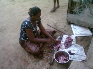 Woman preparing fish for dinner